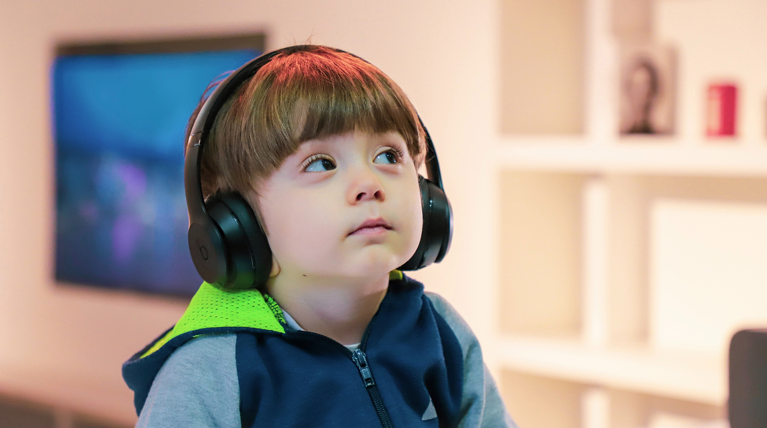 Image of a little boy with headphones